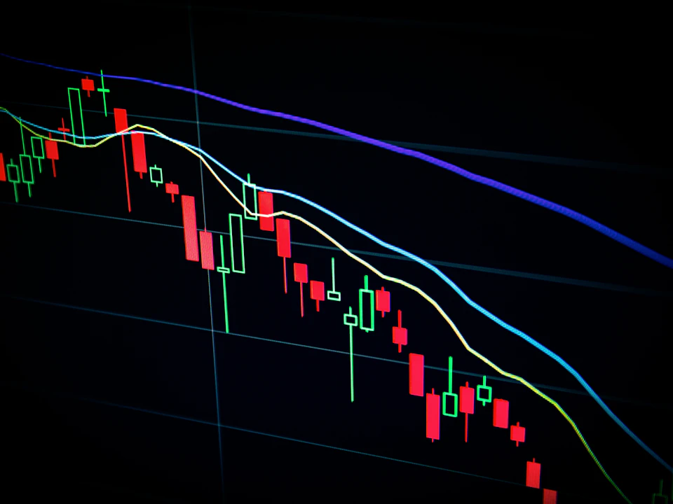 Futuristic trading desk with multi-monitor analytics dashboard